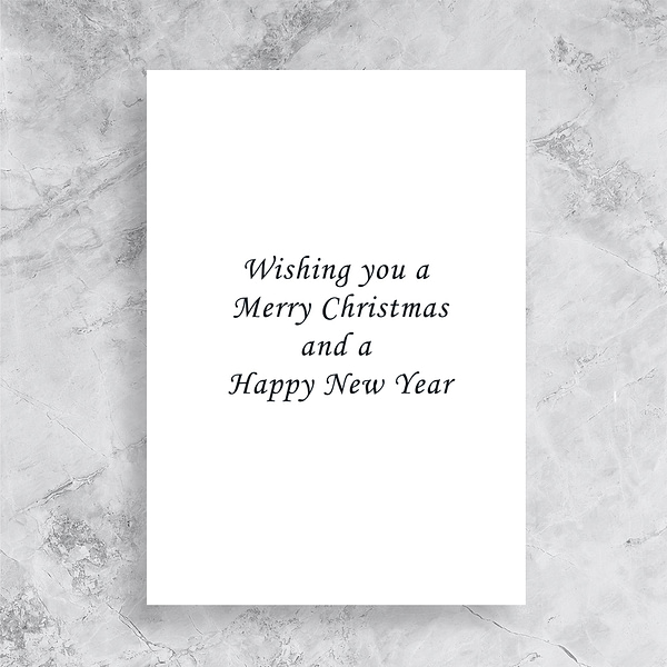 Inside of a Christmas Card saying "Wishing you a Merry Christmas and a Happy New Year"