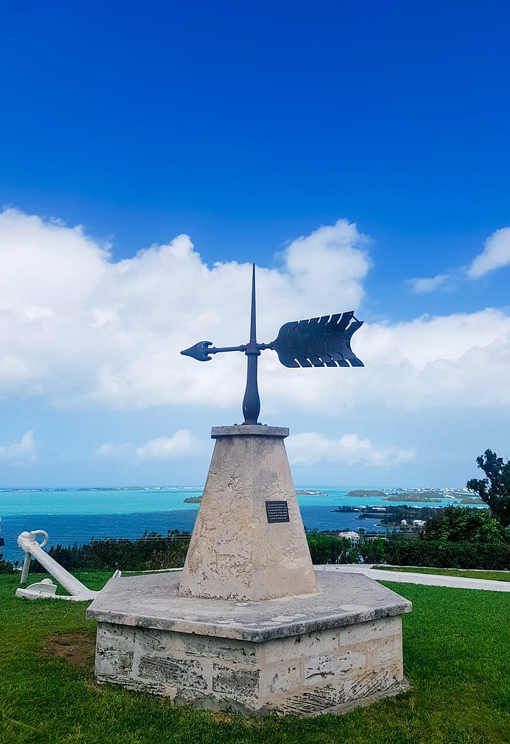 White Anchor, black Arrow statue on cement base, overlooking sea from Gibb's Hill Lighthouse, Bermuda.