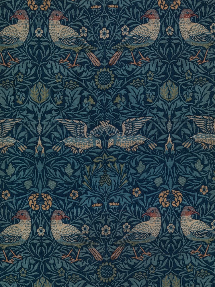 woven wool tapestry pattern by William Morris of two birds. Yellow, green and brown tones within the tapestry.