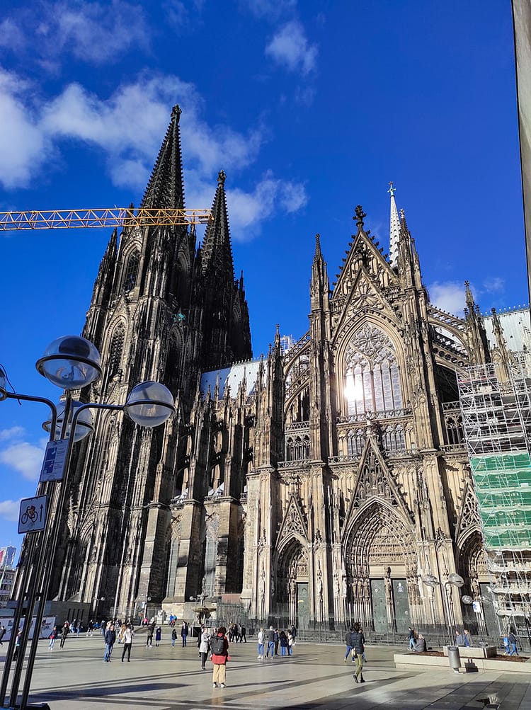 View of Kölner Dom (Cologne Cathedral) with bright blue sky in background