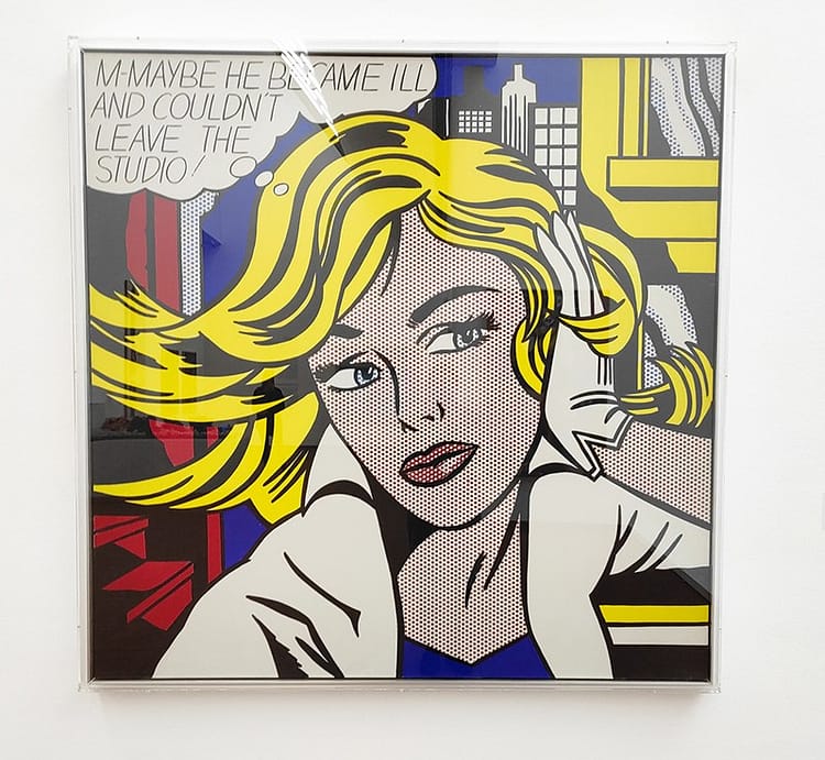 Pop art image of woman's face with blonde hair in Museum Ludwig. A Girl's Picture, M-Maybe by Roy Lichenstein.